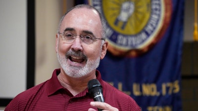 United Auto Workers President Shawn Fain speaks to Volkswagen auto workers, April 19, 2024, in Chattanooga, Tenn., after workers at a VW factory voted to join the UAW.