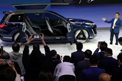 Jerry Gan, CEO of Geely Auto Group unveils the Galaxy Starship a new technology flagship AI-driven SUV prototype during Auto China 2024 in Beijing, Thursday, April 25, 2024.