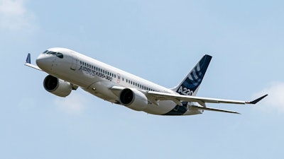 An Airbus A220 lands at Toulouse-Blagnac airport.