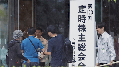 Toyota shareholders arrive for a meeting in Toyota, Aichi prefecture, central Japan,