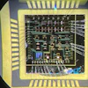 A wire-bonded die consisting of over 20 gallium nitride high-electron mobility transistors.