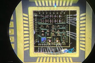 A wire-bonded die consisting of over 20 gallium nitride high-electron mobility transistors.