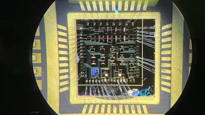 A wire-bonded die consisting of over 20 gallium nitride high-electron mobility transistors.