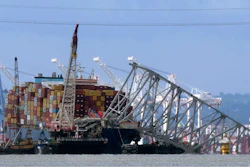 The collapsed Francis Scott Key Bridge rests on the container ship Dali, May 12, 2024, in Baltimore, as seen from Riviera Beach, Md.
