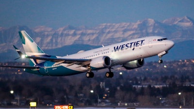 A WestJet airplane takes off in Calgary, Alta.