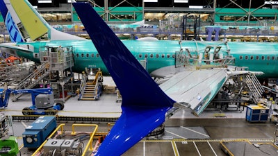 Boeing 737 MAX airplanes are shown on the assembly line during a media tour at the Boeing facility in Renton, Wash.