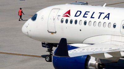 A Delta Air Lines jet leaves the gate at Logan International Airport in Boston.