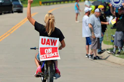 Lear production worker Abigail Fletcher rides her mini bike in support of the picket line as members of United Auto Workers Local 282 continue their strike against the car and truck seat manufacturer in Wentzville, Mo. on Tuesday, July 23, 2024.