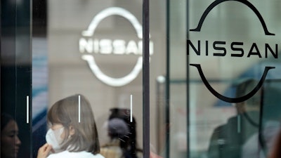 Logos at a Nissan showroom are seen in Ginza shopping district in Tokyo.