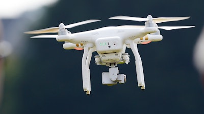 A DJI Phantom 3 drone flies during a drone demonstration at a farm and winery in Cordova, Md. China