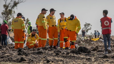 Investigators from Israel examine wreckage at the scene of the Ethiopian Airlines Boeing 737 Max 8 crash near Bishoftu, or Debre Zeit, south of Addis Ababa, in Ethiopia.