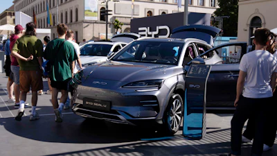 Visitors watch a BYD Seal U car at the IAA motor show in Munich, Germany.