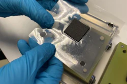 The sample is taken from the cell housing for analysis in a scanning electron microscope after a stress test.