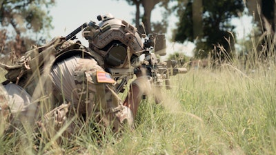 Special forces soldier in battle training scenario.