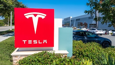 Tesla Delivery Center sign.