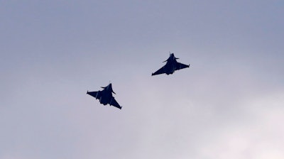 Two French Dassault Rafale fighter jets fly after a signing ceremony between French President Emmanuel Macron and Croatia's Prime Minister Andrej Plenkovic in Zagreb, Croatia.