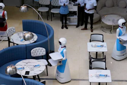 Robotic waiters serve customers at a Robot Cafe in Nairobi, Kenya, Aug. 29, 2024.