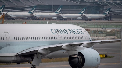 A Cathay Pacific airplane taxis at Hong Kong International Airport in Hong Kong.