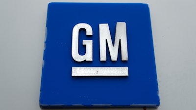 A General Motors logo is displayed outside the General Motors Detroit-Hamtramck Assembly plant.
