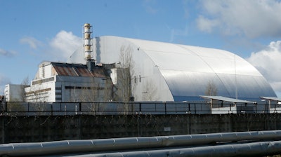 A shelter construction covers the exploded reactor at the Chernobyl nuclear plant, in Chernobyl, Ukraine.