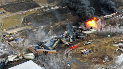 In this photo taken with a drone, portions of a Norfolk Southern freight train that derailed the previous night in East Palestine, Ohio, remain on fire at mid-day, Feb. 4, 2023.