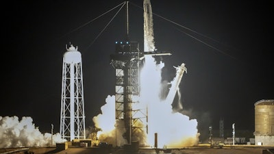 A SpaceX Falcon 9 rocket with a crew of four lifts off from pad 39A at the Kennedy Space Center in Cape Canaveral, Fla.