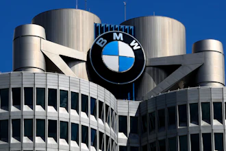 The logo of German car manufacturer BMW is fixed at the headquarters in Munich, Germany