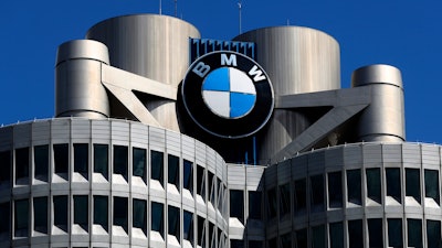 The logo of German car manufacturer BMW is fixed at the headquarters in Munich, Germany