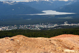Piles of ore discarded decades ago are seen with the town of Leadville, Colo., in the background