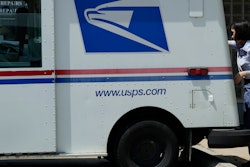 A U.S. Postal Service employee makes deliveries in Northbrook, Ill.