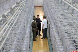 This undated photo provided on Friday, Sept. 13, 2024, by the North Korean government shows its leader Kim Jong Un, center, on an inspecting visit at what they say is an institute of nuclear weapons and a facility for nuclear materials at an undisclosed location in North Korea.