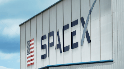 The SpaceX logo is displayed on a building, Tuesday, May 26, 2020, at the Kennedy Space Center in Cape Canaveral, Fla.