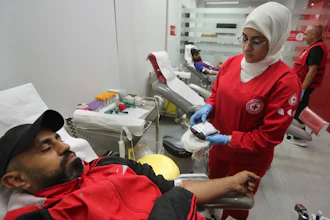 People donate blood for those who were injured by their exploded handheld pagers, at a Red Cross center, in the southern port city of Sidon, Lebanon, Tuesday, Sept. 17, 2024.