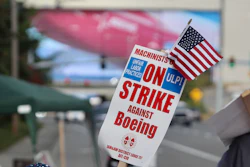 A strike sign is waved on the union machinist picket line near Boeing's factory in Everett, Washington.