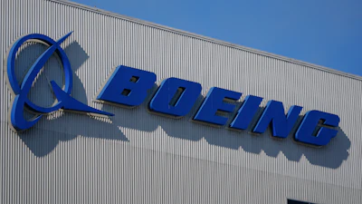 The Boeing logo is displayed at the company's factory Tuesday, Sept. 24, 2024, in Renton, Wash.