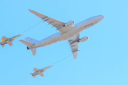 Jets refueling from a larger refuel plane.