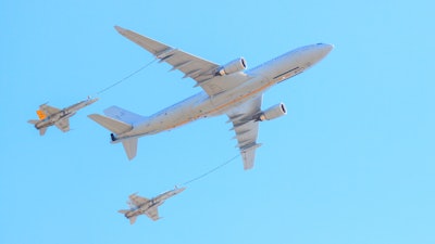 Jets refueling from a larger refuel plane.