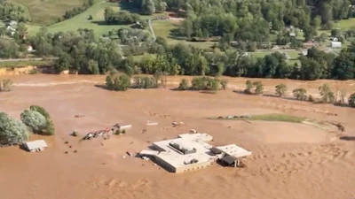 This image taken from video from the Tennessee Emergency Management Agency shows a helicopter on the roof of Unicoi County Hospital in Erwin, Tenn., where patients and staff had to be rescued from after the Nolichucky River flooded and surrounded the building from Hurricane Helene, Friday, Sept. 27, 2024.