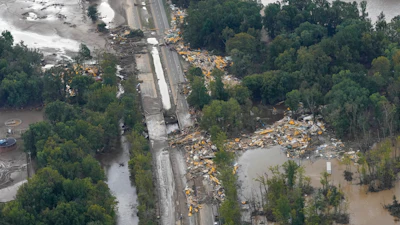 An aerial view of flood damage in the aftermath of Hurricane Helene, Saturday, Sept. 28, 2024, in Erwin, Tenn.