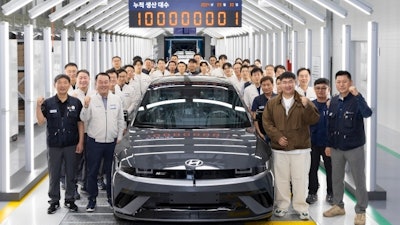 Moon Yong Moon, Head of Korean Metal Worker's Union Hyundai Motor Branch; Dong Seock Lee, President and Head of Domestic Productions and Chief Safety Officer at Hyundai Motor Company; and the customer who received the 100 millionth and first Hyundai Motor vehicle
