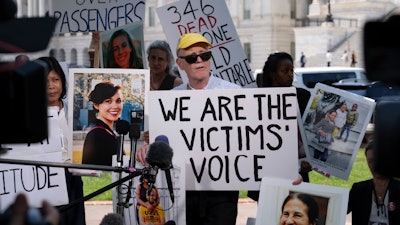 Chris Moore, parent of Danielle, one of the crash victims of a Boeing 737 MAX8 in Ethiopia, speaks during a news conference on Capitol Hill, June 18, 2024, in Washington.