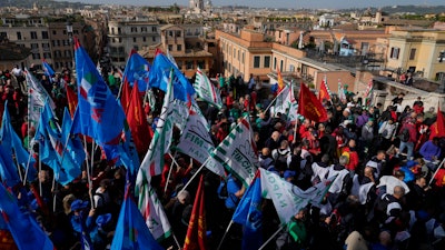 Workers of automotive sector march during a demonstration in Rome on the occasion of their national strike, Friday, Oct. 18, 2024.