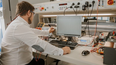 A Collins engineer works in the lab at the company's facility in Nordlingen, Germany.