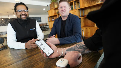 Ceo And Co Founder Dave Hughes (at Centre) With Novosound's Ultrasound Blood Pressure Monitor (by Stewart Attwood)