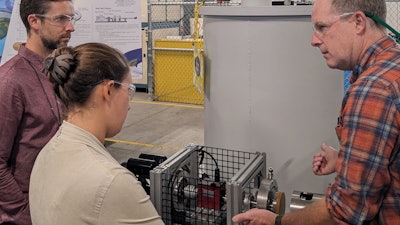 Colin Heye and Kayla Rajsky (from left) of Interlune at Pacific Northwest National Laboratory collaborating with Corey Archipley (right) on novel methods of liquefying helium using the magnetocaloric effect.