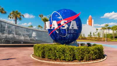 NASA Logo on Globe at Kennedy Space Center Visitor Complex in Cape Canaveral, Florida, USA.