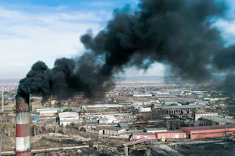 Smoke emitted from a smoke stack of a coal-fired power plant.