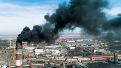 Smoke emitted from a smoke stack of a coal-fired power plant.