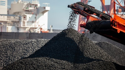 Coal fragments coming off a belt after mining.