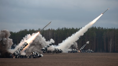 Defense missiles being launched during a military training exercise.